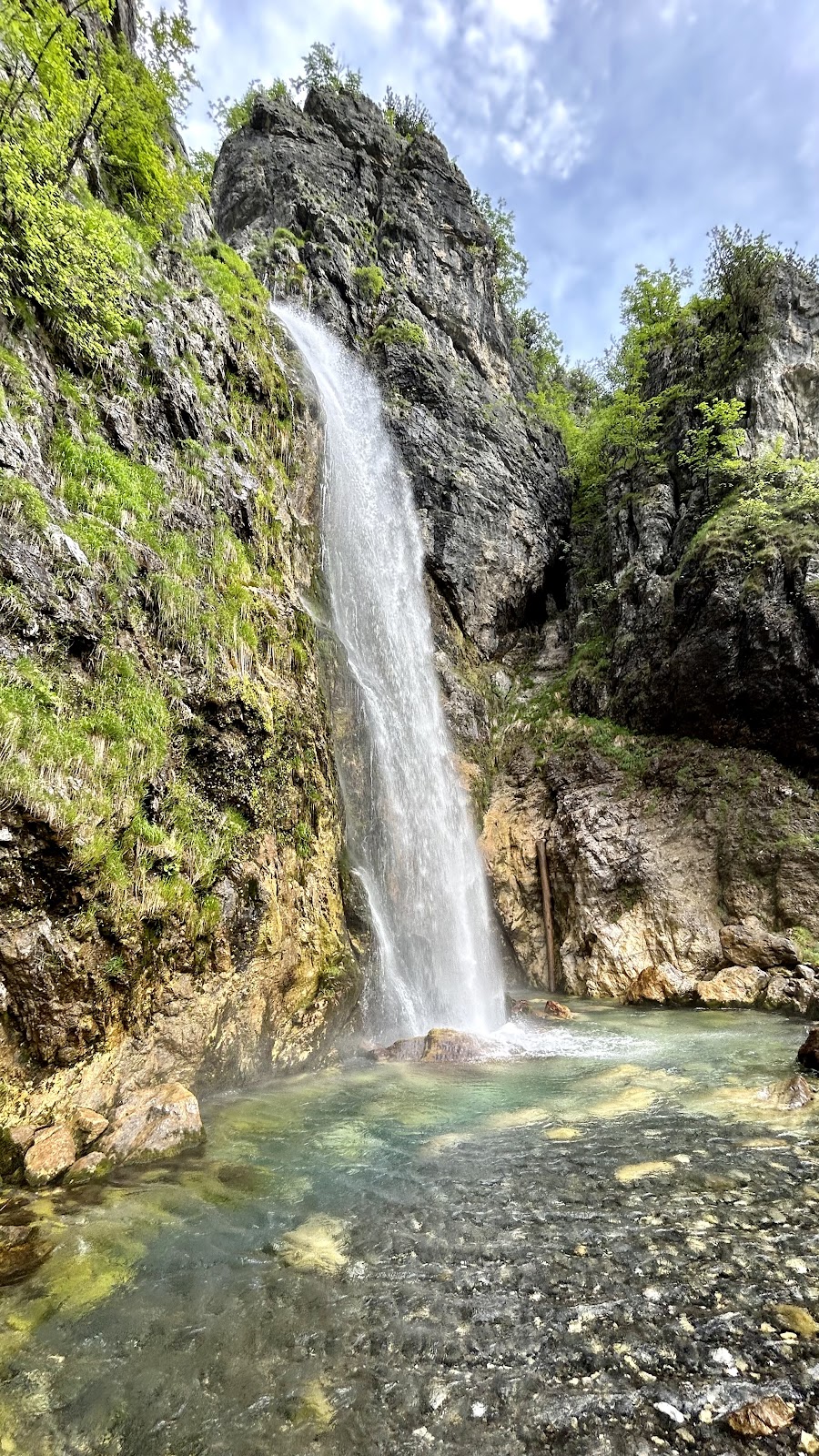 Grunas Waterfall falling from a limestone cliff